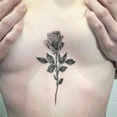 sternum between breast tattoos|Between breast tattoo